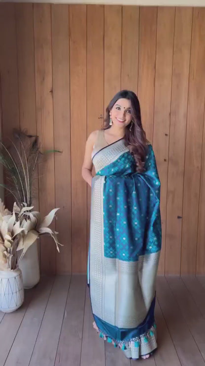 Turquoise blue and silver-toned Woven Design Zari Silk Blend Banarasi Saree